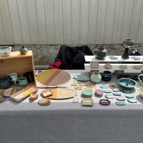 Barn Owl Pottery booth at an outdoor market